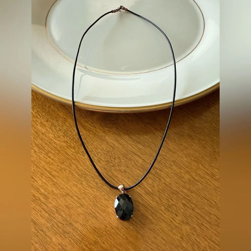 Sterling silver pendant on an 18β waxedβcord